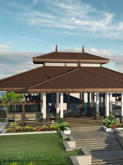 This view of our Balinese-inspired project showcases the main pavilion set within a lush garden. The architecture uses natural materials and an open design to create a tranquil, resort-like feel.