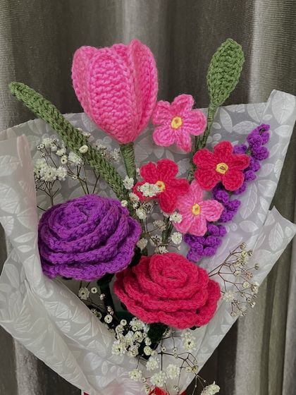 Another angle of my mixed flower bouquet, showing the rich purple and pink tones. Each flower is individually crafted and then arranged to create a balanced and beautiful composition.