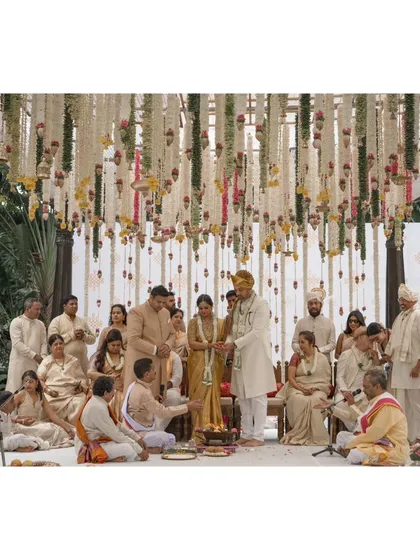 A duplicate of 314, showing the wedding ceremony from a slightly different angle, with the floral decor as a stunning backdrop.