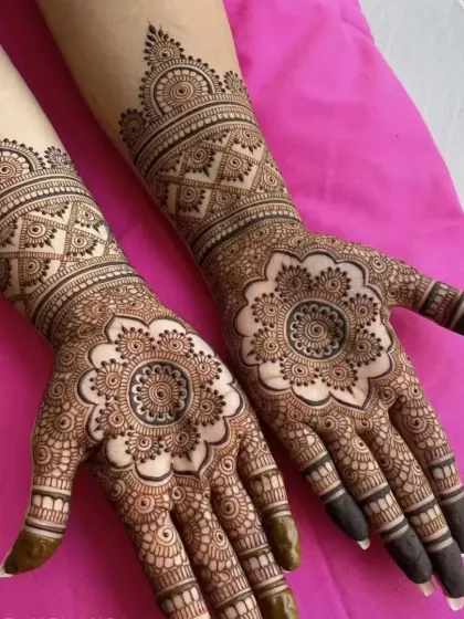 A classic and popular design featuring symmetrical mandalas on the palms.