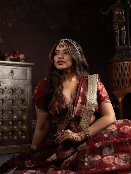 A full-length shot capturing the complete mood of the Heeramandi-inspired look. The makeup, hair, outfit, and setting all come together to tell a story of timeless grace.