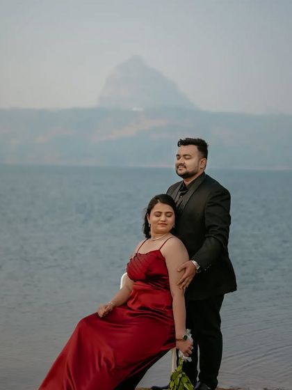 A stunning portrait of the couple with a mountain in the background, showcasing the grandeur of a destination pre-wedding shoot.