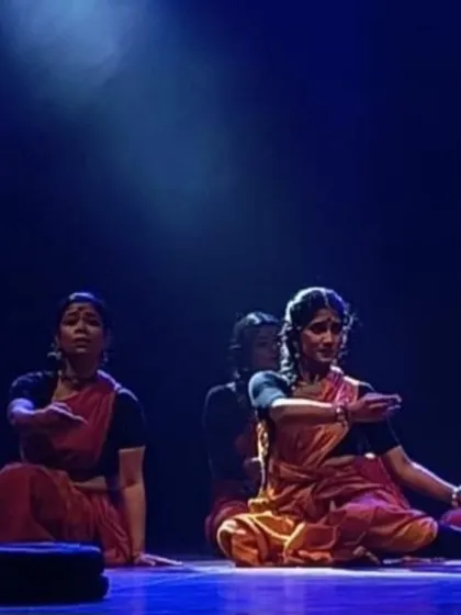 The dramatic lighting in 'Songs of the Millstone' helps to create a poignant atmosphere. Here, the dancers are captured in a moment of quiet reflection, their expressions conveying the weight of their stories.