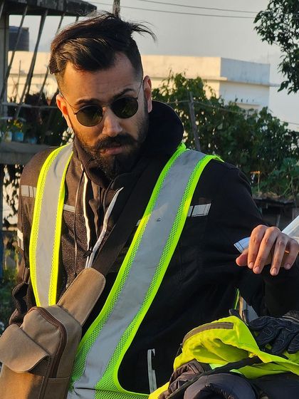 Geared up and ready to ride. This portrait shows my look for adventure shoots, suitable for modeling motorcycle gear, outerwear, and accessories like sunglasses.