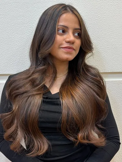 This bride to be chose a subtle warm caramel brown, and the result is absolutely dreamy. The color adds just the right amount of warmth and dimension to her long hair.