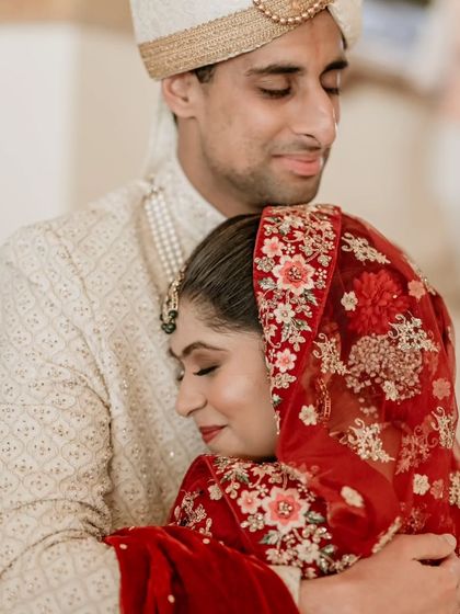 A comforting and emotional embrace, this portrait captures the deep bond and support between the couple.