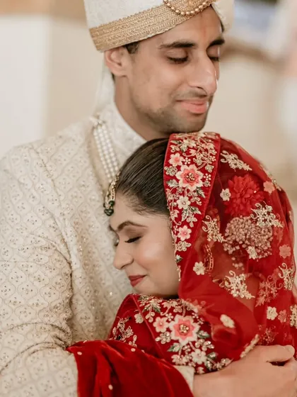A comforting and emotional embrace, this portrait captures the deep bond and support between the couple.