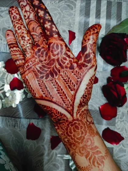 Another beautiful photo of the henna stain with rose petals, showing the intricate details of the design.
