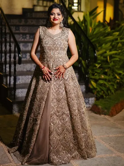A series of photos from a Sangeet night in Goa. This look features a classic combination of smokey eyes and red lips, paired with a side-swept curly hairstyle, creating a glamorous and festive vibe.