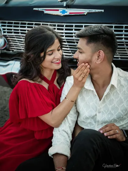 A classic love story with a vintage Chevrolet. The combination of the iconic car and the couple's romantic poses creates a timeless and cinematic pre-wedding photograph.