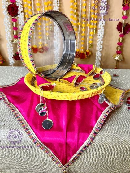 The full view of our yellow and pink mirror-work Karwachauth thali set, designed to bring joy and elegance to your rituals.