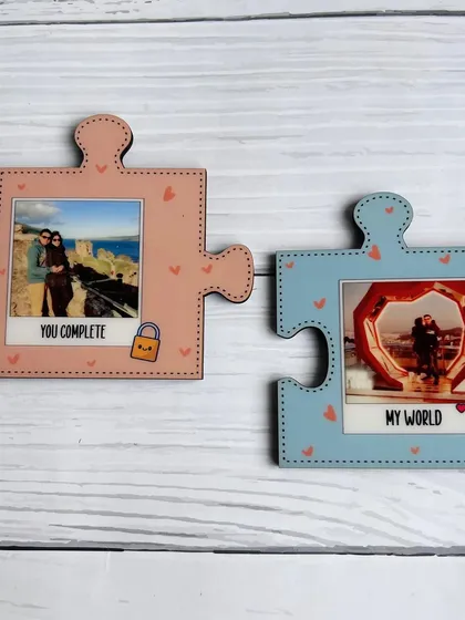 A clear shot of the two puzzle magnets fitted together, showing how they create a single, cohesive picture of a relationship.