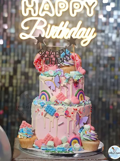 This candyland themed party cake was so much fun to create. With multiple tiers, colorful drips, cupcakes, and tons of sweet details, it shows how I can build a large, vibrant centerpiece for a big celebration.