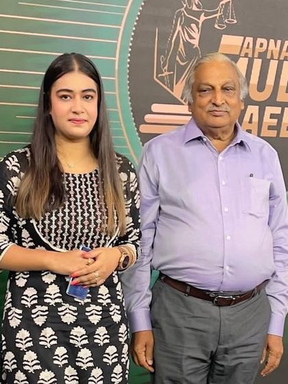 With a senior panelist on the set of 'Apna Mulk Apna Aaeen' at the DD Urdu studio.