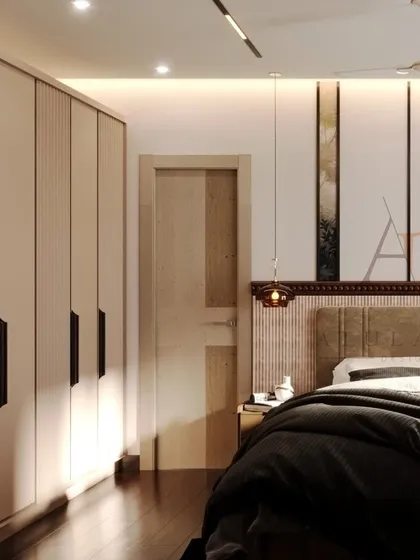 This shot highlights the fluted, floor-to-ceiling wardrobes that provide ample storage while adding textural interest to the bedroom.