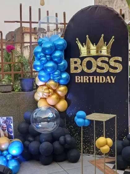 Who's the boss? The birthday boy is! A cool Boss Baby themed setup on a terrace, featuring a black, blue, and gold color scheme for a sharp and stylish look.