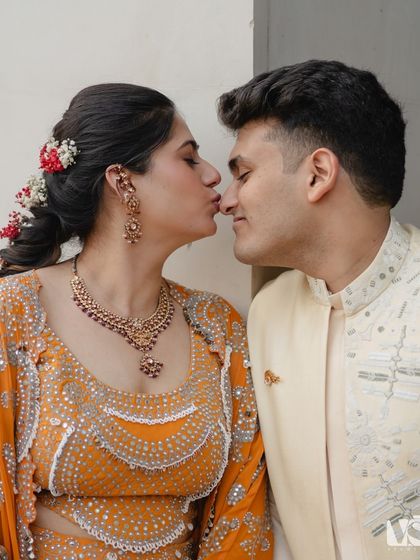 A sweet, playful kiss that perfectly captures the fun-loving relationship between Rashi and Hrithik. These are the candid, happy moments that make a love story unique.