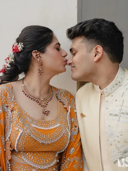 A sweet, playful kiss that perfectly captures the fun-loving relationship between Rashi and Hrithik. These are the candid, happy moments that make a love story unique.