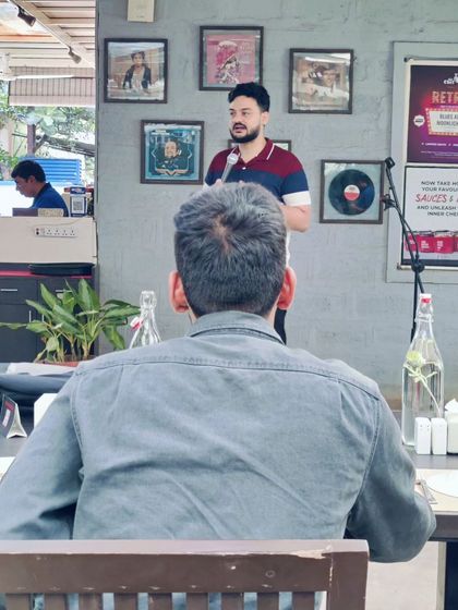 Capturing the relaxed vibe of our daytime comedy shows, this photo shows an audience member enjoying the performance from their table.