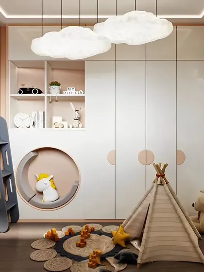 We create cozy and whimsical spaces where kids can dream. This room features cloud-shaped pendant lights, a fun play tent, and a unique bunk bed with a built-in reading nook, blending sleep and play seamlessly.