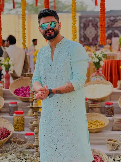 A light blue embroidered kurta, perfect for a daytime Haldi or Mehendi ceremony.