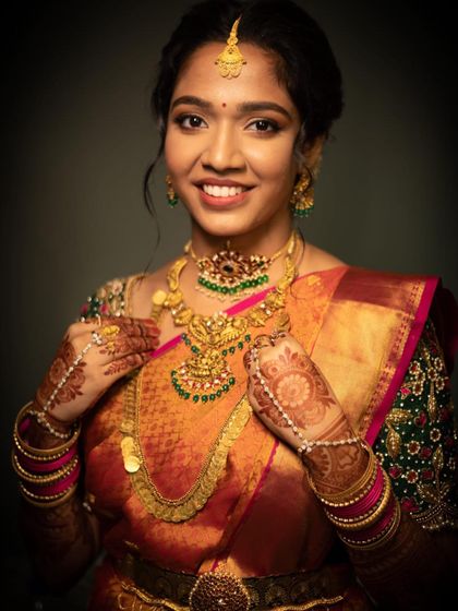 Keshika's smile lights up the frame. I love creating looks that make my brides feel confident and beautiful on their big day.