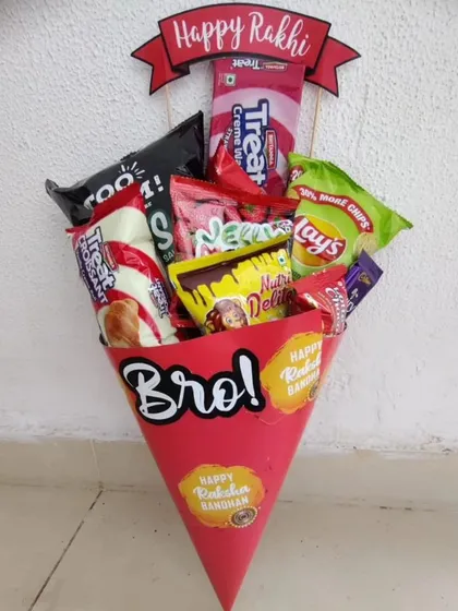 A fun and unique take on a Rakhi gift, this snack bouquet is arranged in a bright red cone. It's overflowing with chips, biscuits, and chocolates, making it a kid-friendly hamper that's easy to gift and exciting to receive.