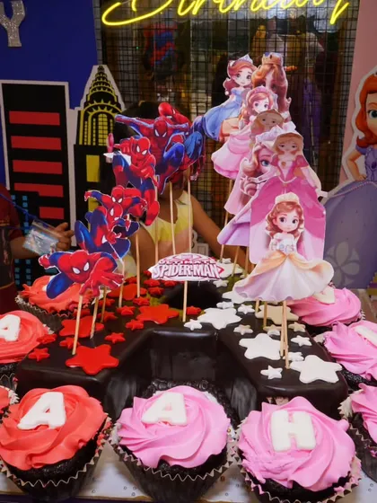 A cake fit for heroes and princesses! This amazing cake features both Spiderman and Disney Princess toppers, showing how I can cater to multiple interests to make every child happy.