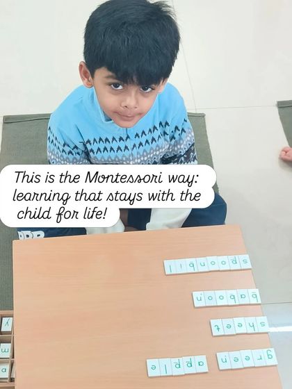 This is the Montessori way: learning that stays with the child for life. This child is using the movable alphabet to build words, a foundational activity for reading and writing.