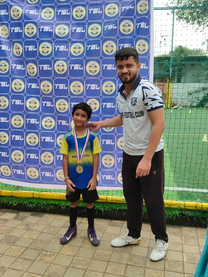 Recognition for hard work. A young player from our U8s receiving his medal for an outstanding performance.