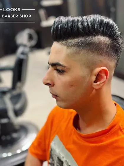 Another angle of this sharp fade, showing the clean transition and expert styling that goes into every cut.