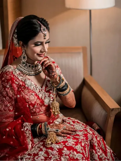 A beautiful candid moment of the bride. Her makeup is designed to look perfect from every angle, with a focus on a radiant, glowing complexion.
