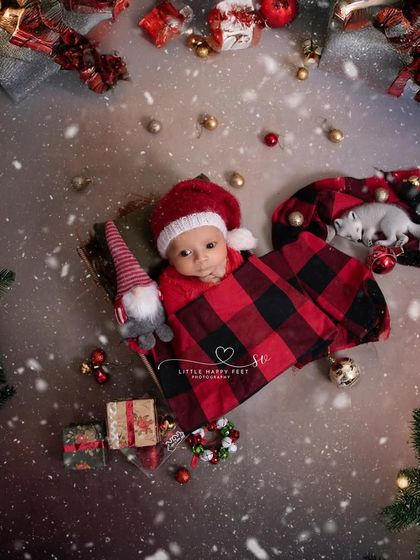 Silent night, sweet baby tight. This overhead shot of a baby in a sleigh, surrounded by Christmas decorations, is full of holiday cheer.