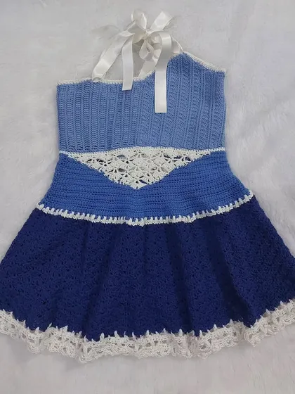 This version of the Aviva Dress features a different lace panel design, showing how the pattern can be customized.