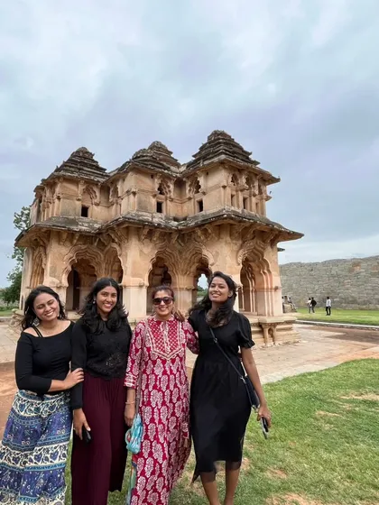 A group of women travelers at the Lotus Mahal in Hampi.