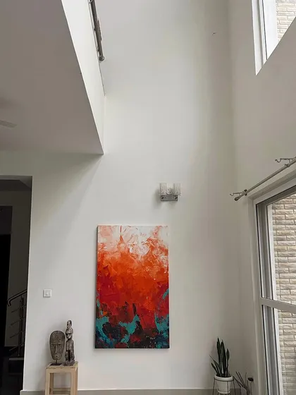 A large 5x3 feet abstract painting, "The Uprising," is perfectly complemented by the gallery's expansive wall space and natural light. We designed the venue to ensure every piece is seen at its best.