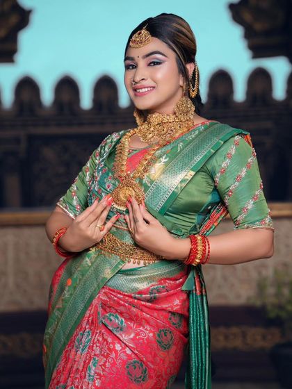 A joyful and classic bridal pose, showing off the complete look with our rental jewellery.