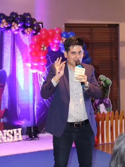 A good emcee knows how to command the stage and engage the audience. Here I am, getting the crowd ready for the next round of fun and games.