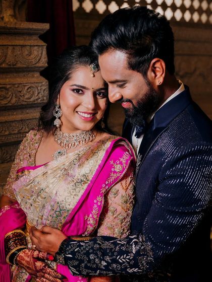 A close-up couple portrait filled with joy. Her makeup is designed to enhance her smile and create a radiant look.