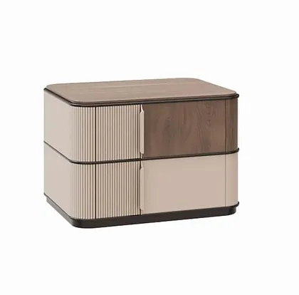 A studio shot of the two-tone bedside table, showing the contrast between the reeded drawer front, the smooth painted drawer, and the rich wood veneer top.