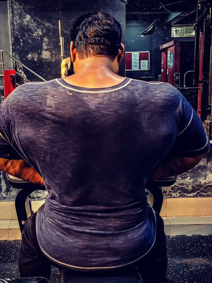 The gym is my powerhouse. A shot of my back after a workout, showing the results of my dedication.