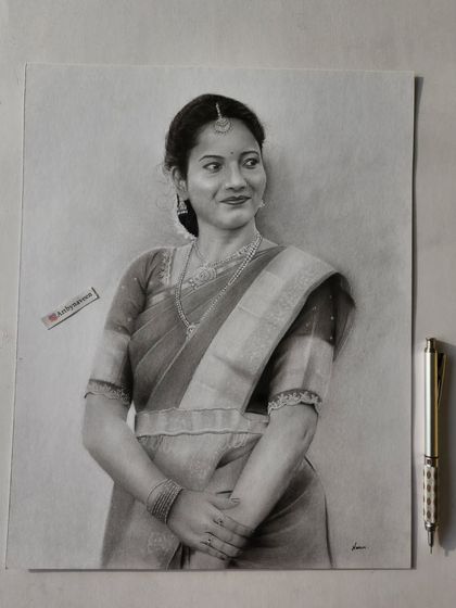 A finished portrait of a woman in a saree, showcasing the detailed fabric and her graceful pose.