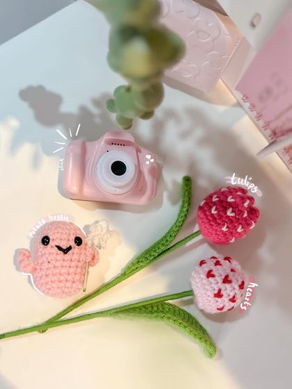 On Wednesdays, we wear pink. This little flat lay features some of my favorite pink creations: heart-patterned tulips and a tiny, cheerful potato plushie desk buddy.