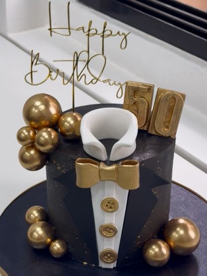 Dressed to impress, this tuxedo cake was custom-made for a gentleman's 50th birthday. Every detail, from the crisp collar to the edible gold bow tie, was designed for maximum sophistication.