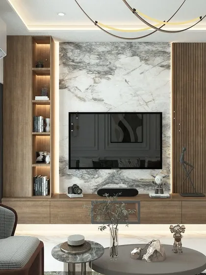 This TV unit combines a rich wood finish with a marble-look back panel. We included both open and closed storage, along with integrated lighting in the vertical shelf, to create a functional and stylish focal point.