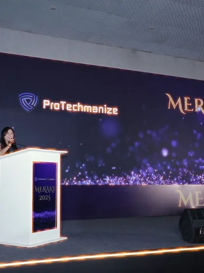 At the podium during Meraki 2025. I ensure a commanding stage presence for corporate annual day events and celebrations.
