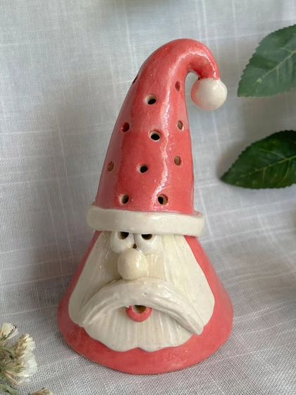 This cheerful Santa tealight holder will cast a warm, festive glow in your home. The light flickers through the small holes in his hat, creating a magical effect.