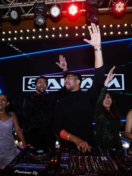 The whole crew behind the decks. When the energy is this high, everyone wants to be where the action is. This is the inclusive, fun atmosphere I create.