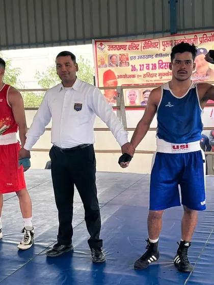 The referee raises his hand. Another gold medal for the academy at the state level.