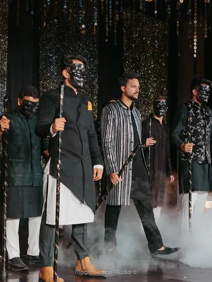 A dramatic entrance for the groom's solo performance. We used masks, props, and smoke effects to build suspense and create a powerful start to his act.